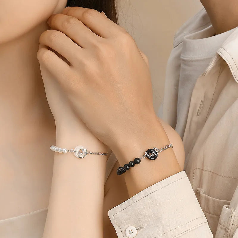925 sterling silver couple bracelet with snake design, obsidian pearls, and a safe buckle.