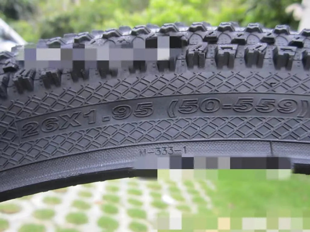Ultralight mountain bike tyre with tread pattern shown, available in multiple sizes including 26, 27.5 and 29 inch diameters.