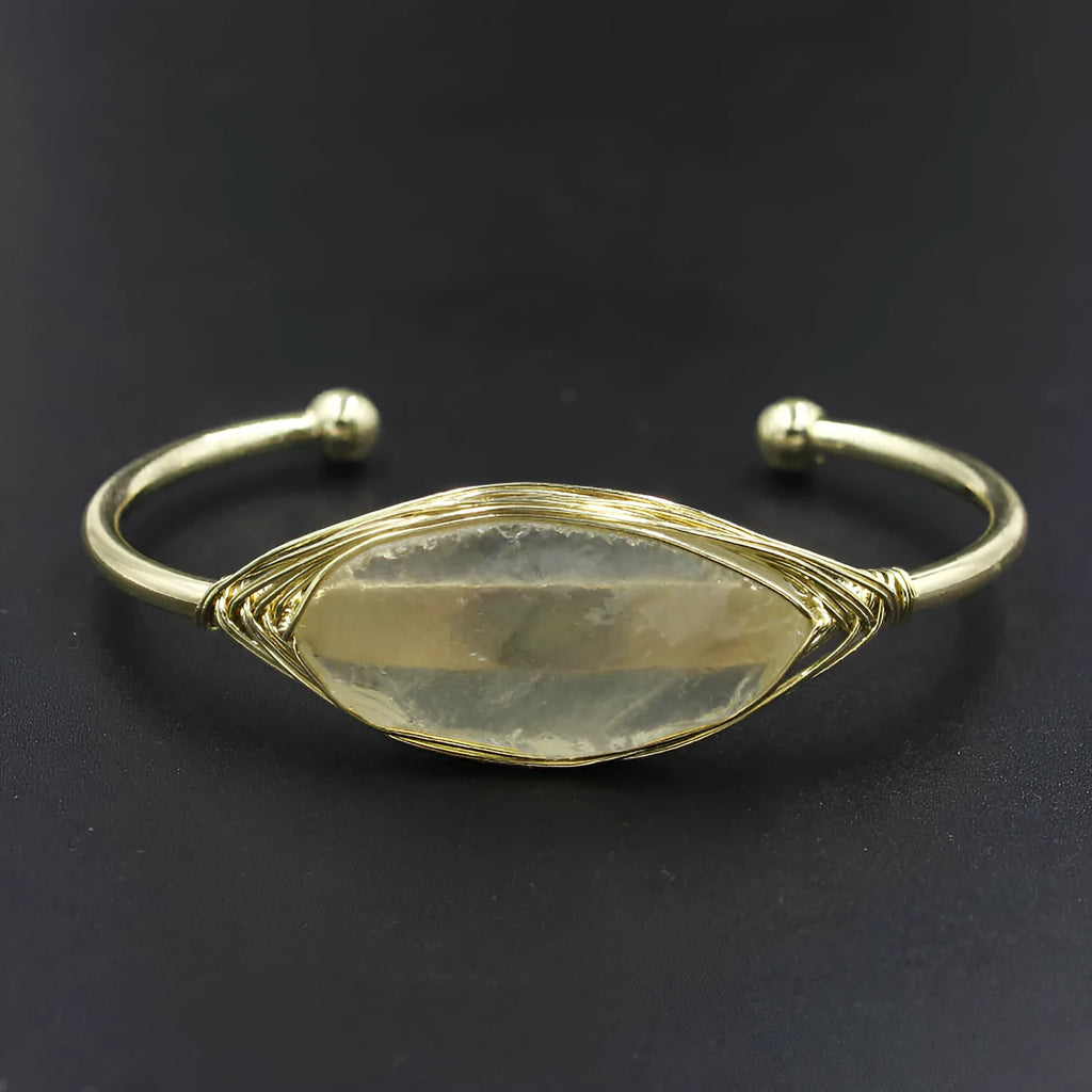 Natural raw gemstone bracelet with 8mm amorphous crystal beads on an adjustable open band.