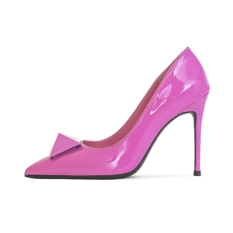 Pink patent leather women's stiletto heels with pointed toe and ankle buckle.
