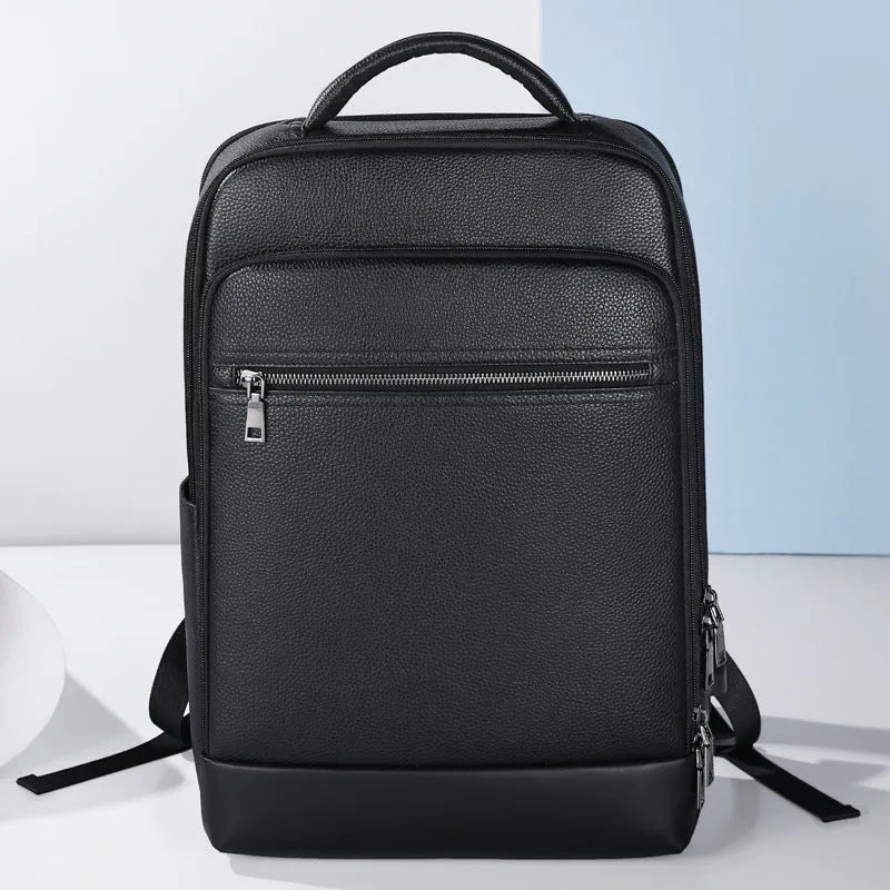 Black leather men's business computer backpack with curved shoulder straps and sewing line details