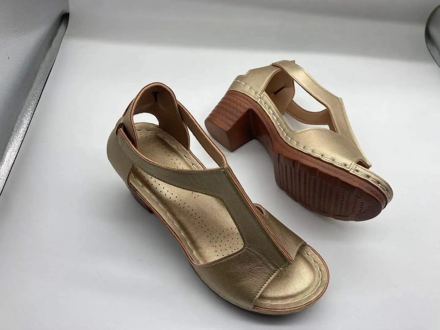 Women's white peep toe wedge sandals with Roman style buckle and low heel