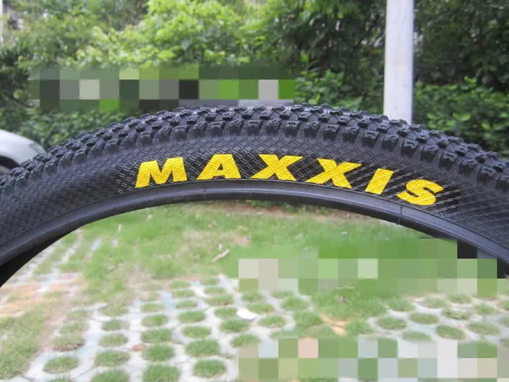 Ultralight mountain bike tyre with tread pattern shown, available in multiple sizes including 26, 27.5 and 29 inch diameters.