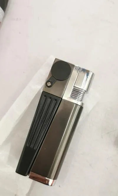 Silver and black foldable metal pipe lighter with stash compartment closed.