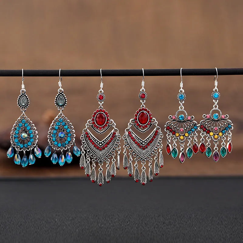 Purple drop shape fringe earrings with retro crystal detailing and ethnic style elements