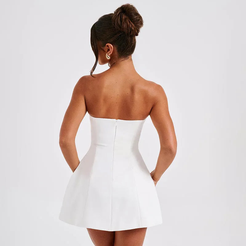 Backless slim-fit tube dress with A-line skirt in solid colour options.