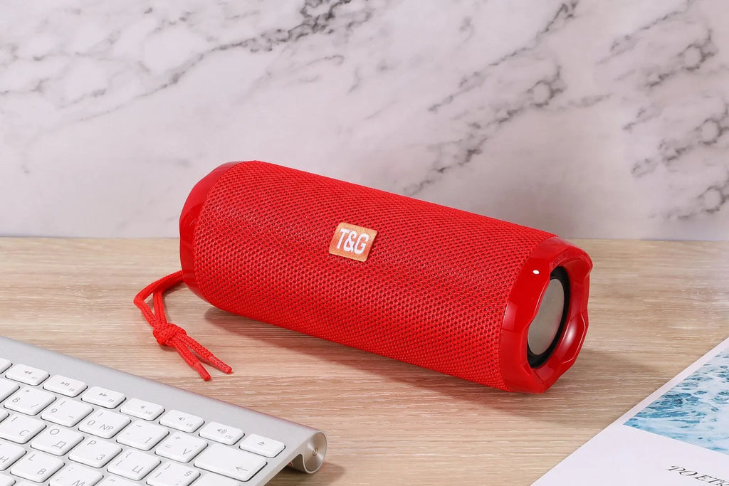 Fabric-covered portable Bluetooth speaker in multiple colours showing card holder slot.