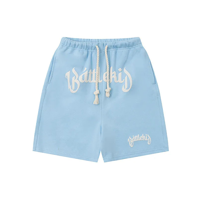 Loose fit cropped sweatpants in cotton-blended fabric on hanger, showing street style design