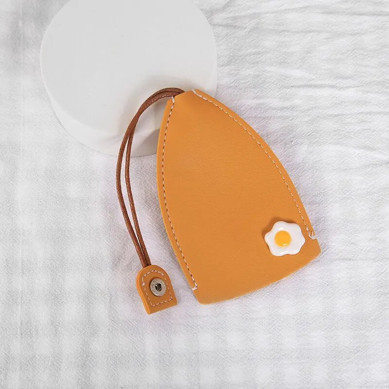 Cartoon design pull-out car key case made from soft PU leather, showing approximate size.