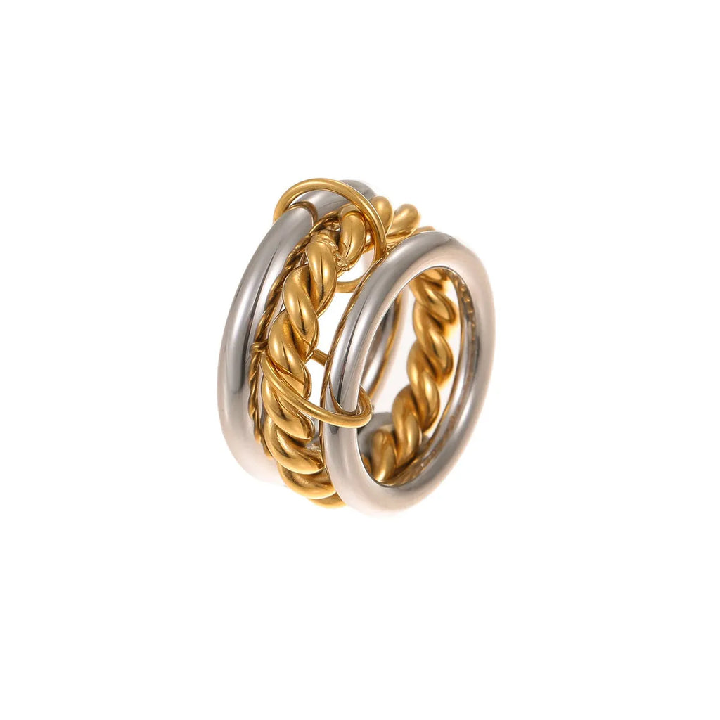 Stacked gold plated stainless steel ring set with exaggerated design on hand