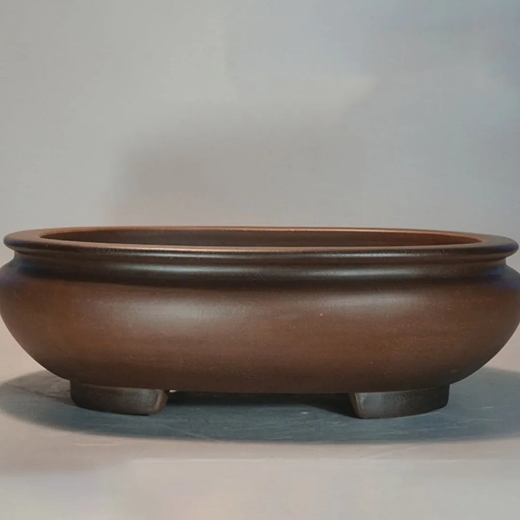 Handmade purple clay ceramic flowerpot measuring 58x47x18cm for indoor desktop plant displays.
