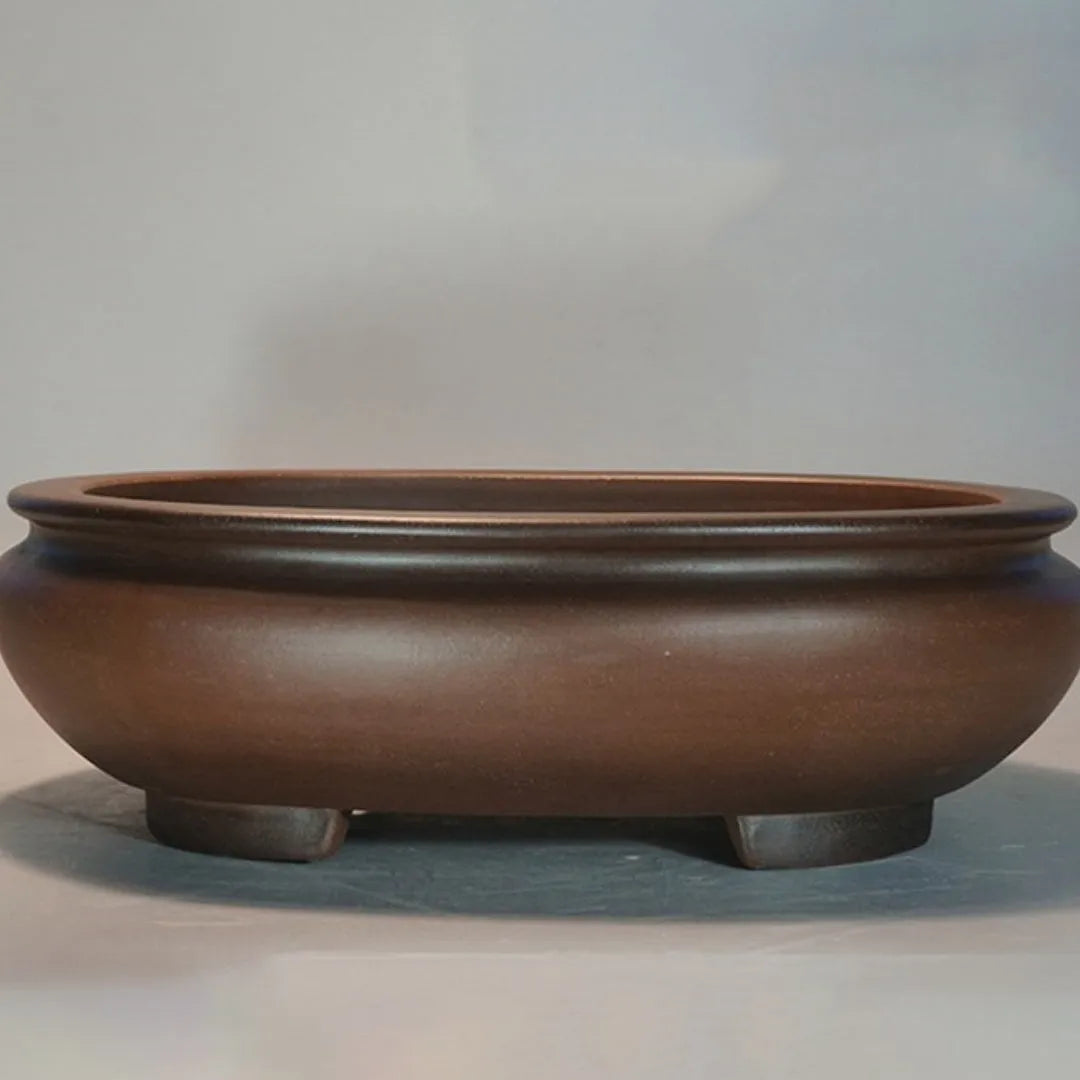 Handmade purple clay ceramic flowerpot measuring 58x47x18cm for indoor desktop plant displays.