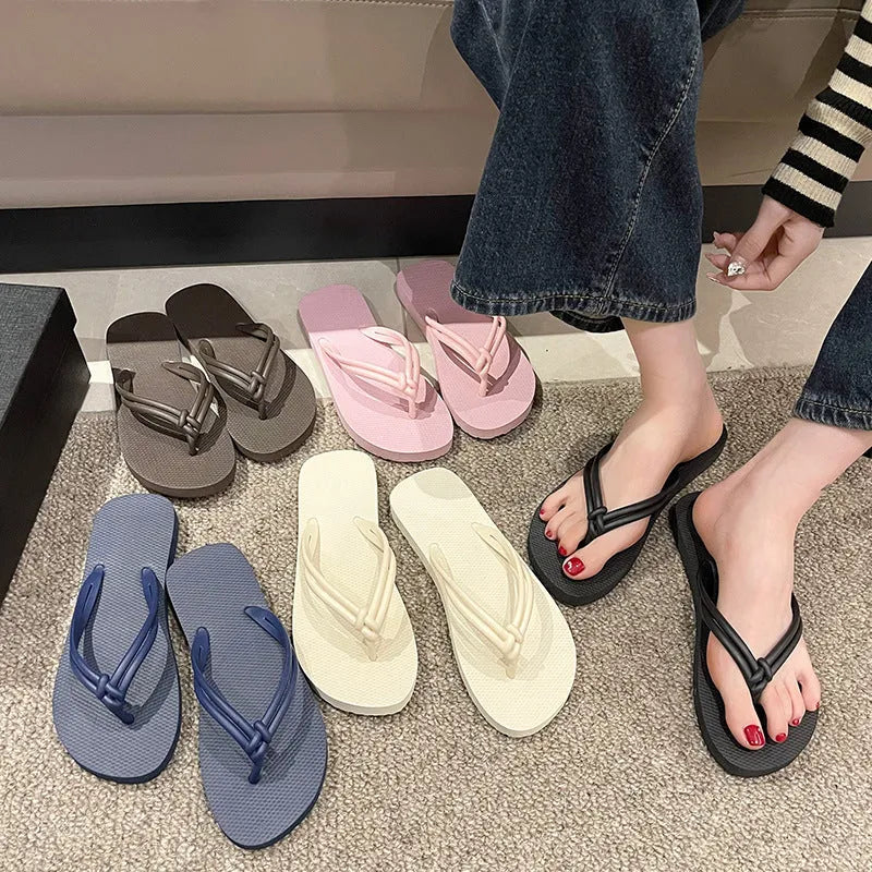 Men's PVC toe covering flip flops in beige on a plain background, showing non-slip sole.