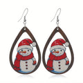Wooden Christmas earrings with printed tree and snowman designs in geometric shapes