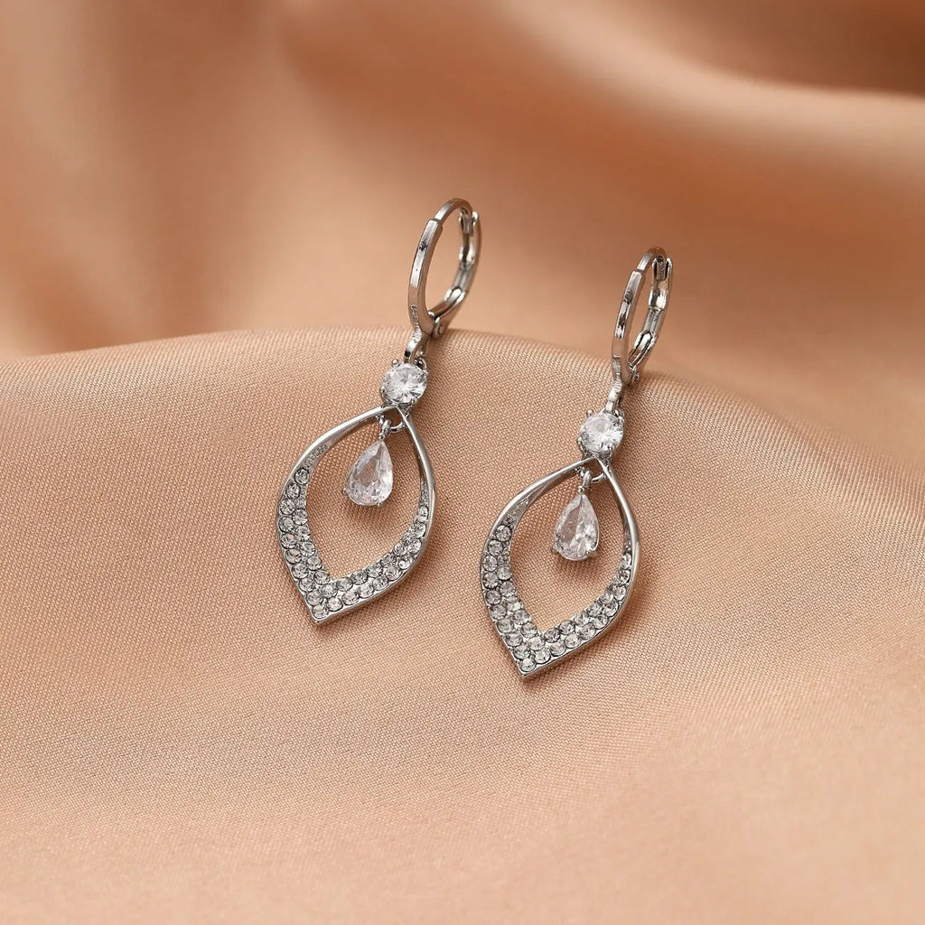 Gold and silver coloured zircon water drop tassel earrings with a tear-drop shape.