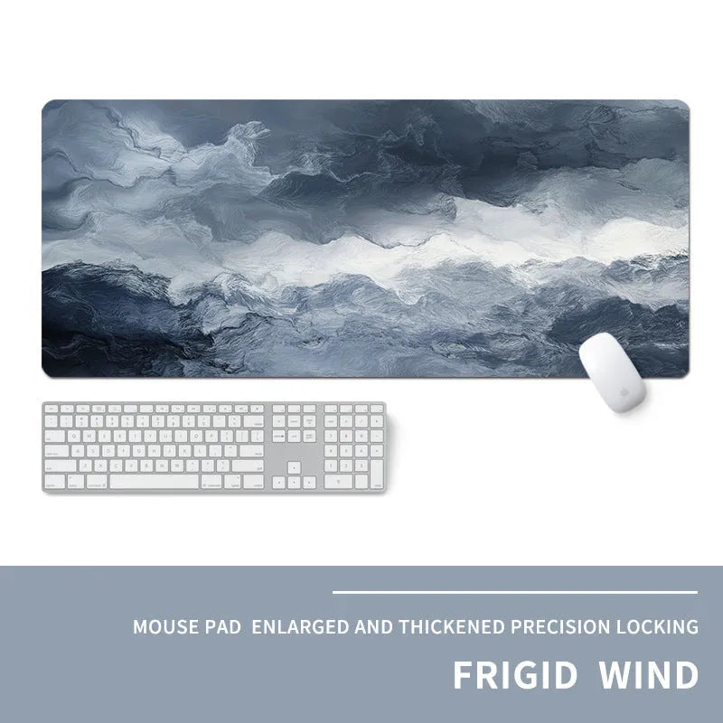 Oversized natural rubber gaming desk mat with graphical print, showing keyboard and mouse placement.