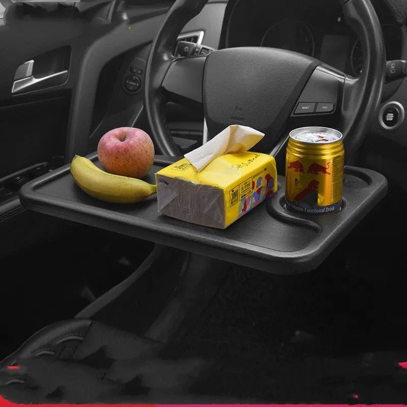 Black plastic car tray desk measuring 42cm by 28cm on a car seat