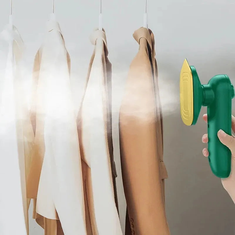 Dark green portable hand-held hanging steam ironing machine with a ceramic panel, shown with a power plug.