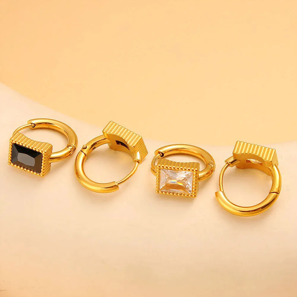 Square geometric design stainless steel earrings with zircon accents in white, black, and green colours.