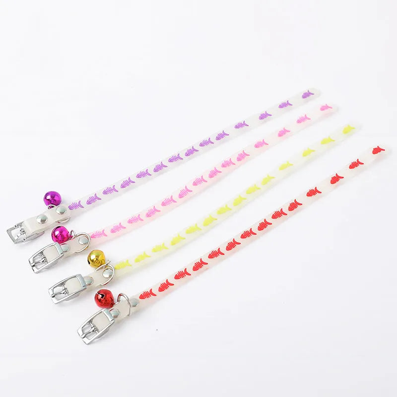 Luminous adjustable cat collar with bell in silicone and metal, showing paw print design for night visibility.