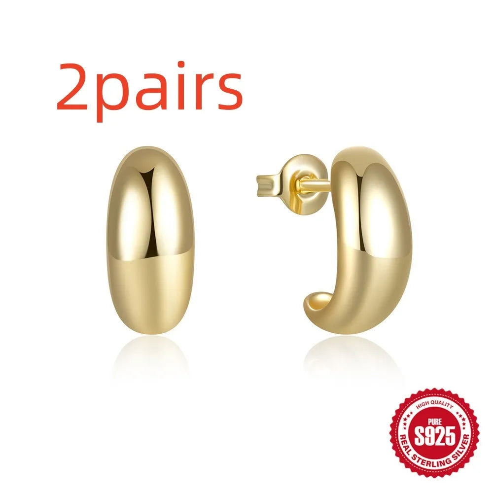 Sterling silver C-shaped geometric ring stud earrings in gold or silver tone.