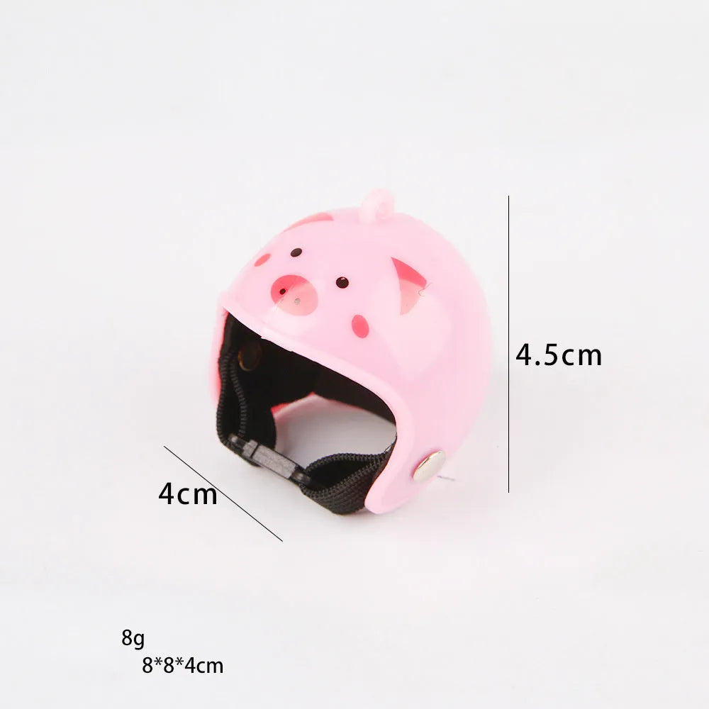 Small hard plastic helmet with elastic straps and sponge lining for a chicken or pet bird.