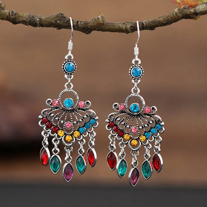 Purple drop shape fringe earrings with retro crystal detailing and ethnic style elements