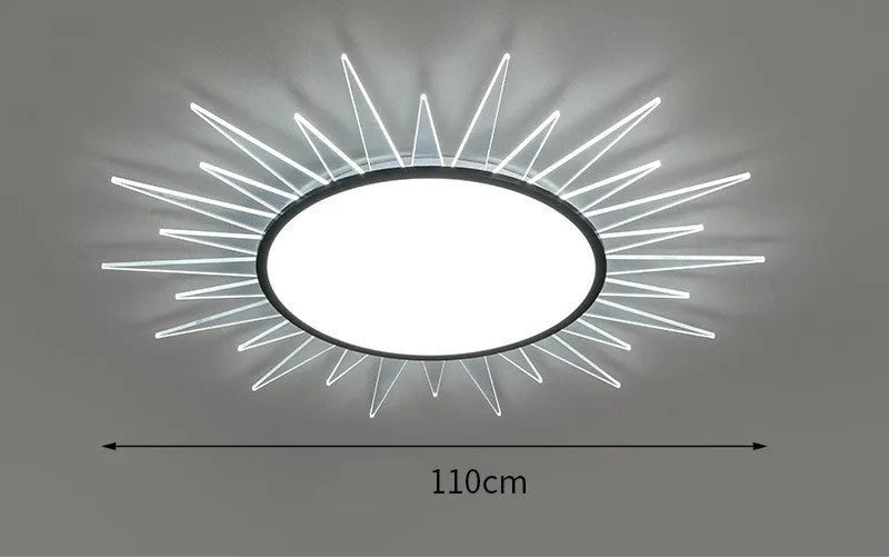 Modern round aluminium LED ceiling lamp with a white shade on a ceiling.
