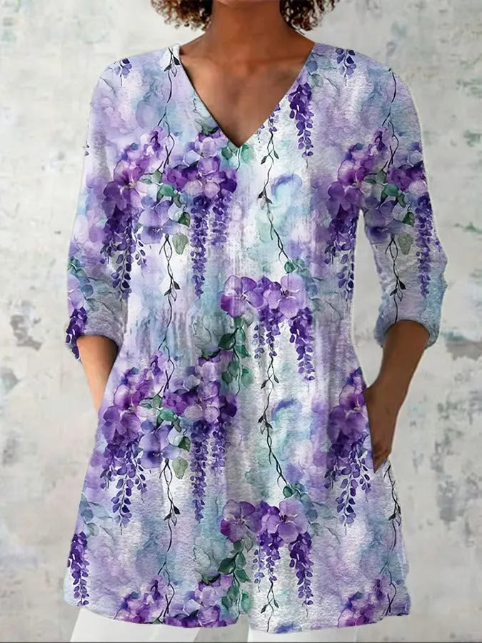 Women's slim-fit retro printed long-sleeved polyester top on a hanger, showing detail of digital print.