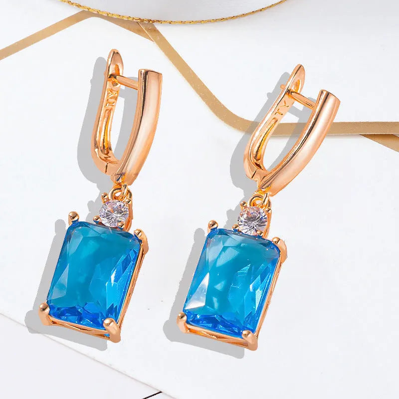 Square geometric copper earrings with electroplated gold finish showing quadrilateral design elements