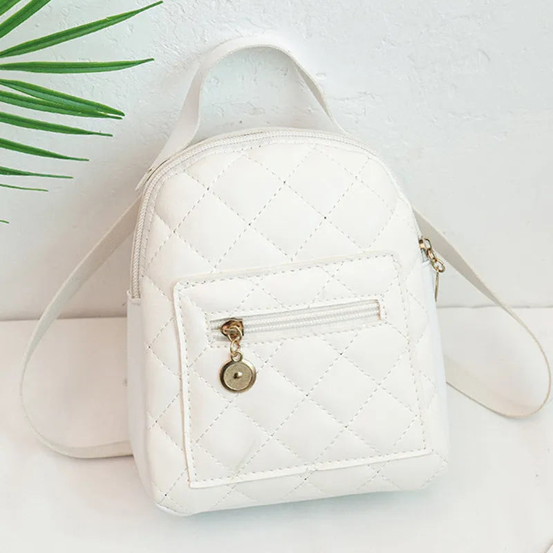 Girls' hard shell backpack with embroidery in black, pink, or white colours showing square shape and sandwich pocket