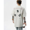 Loose fit black cotton t-shirt with a white letter print design on the front.
