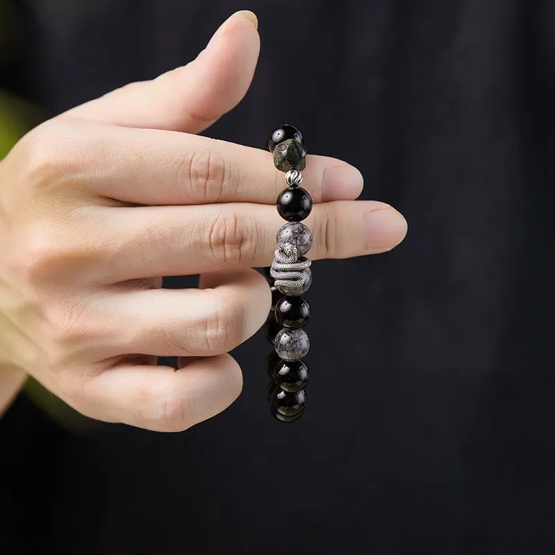 Men's black obsidian and sterling silver snake year bracelet with retro design, 10mm wide.