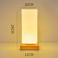 Nordic solid wood USB table lamp with touch dimming showing cube, cylinder, and ball light modes