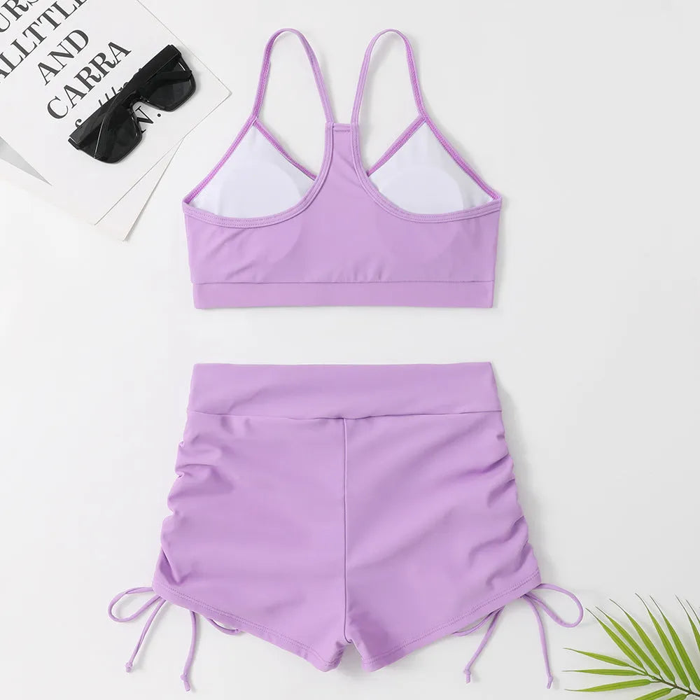 Women's high waist split swimsuit bikini in purple or black with sleeveless design