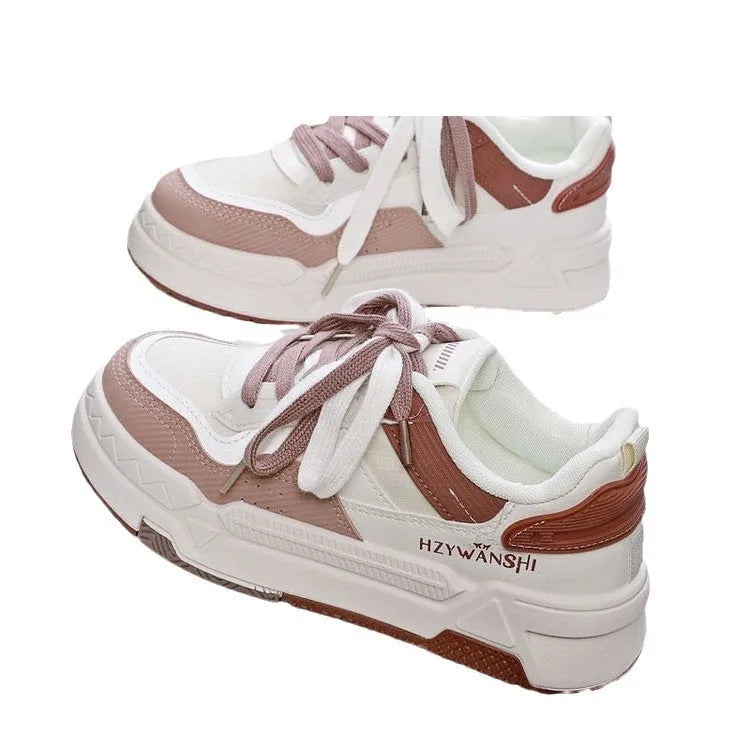 Children's beige platform shoes with thick rubber sole, lace-up front, and cross shoulder straps.