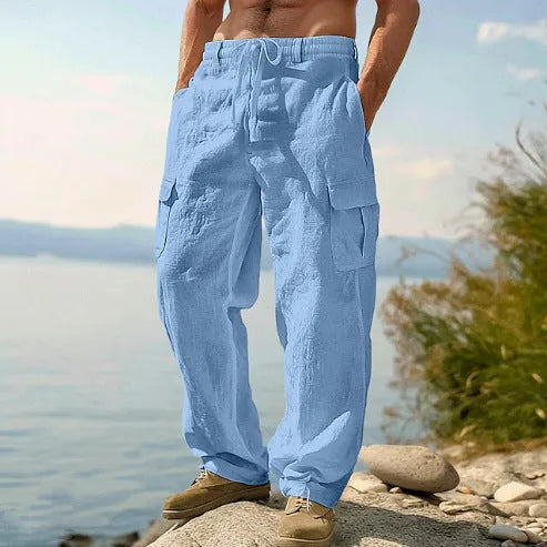 Man wearing loose-fitting, solid-colour cotton wide-leg casual trousers.