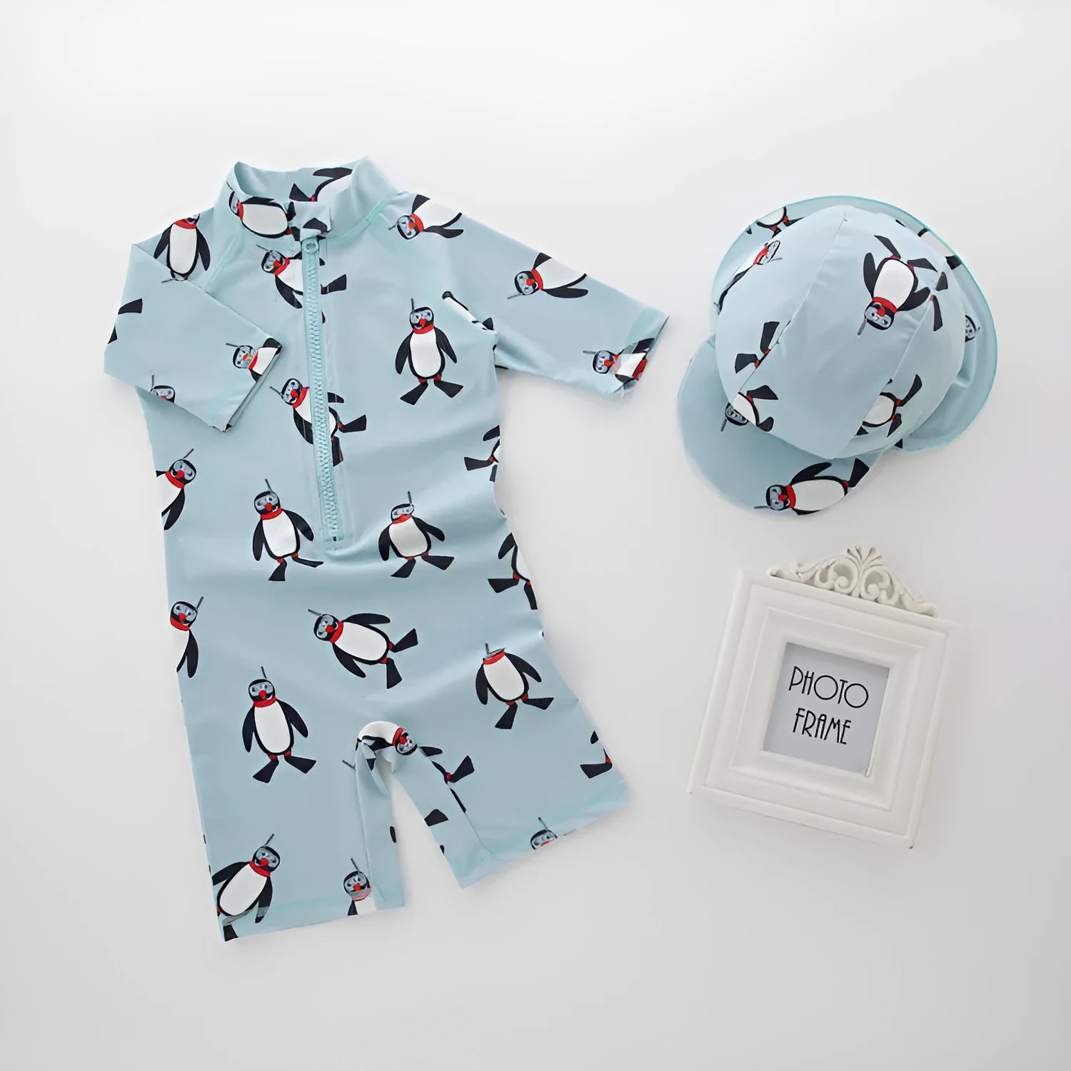 Boys' penguin print long-sleeve one-piece swimsuit with matching swimming cap