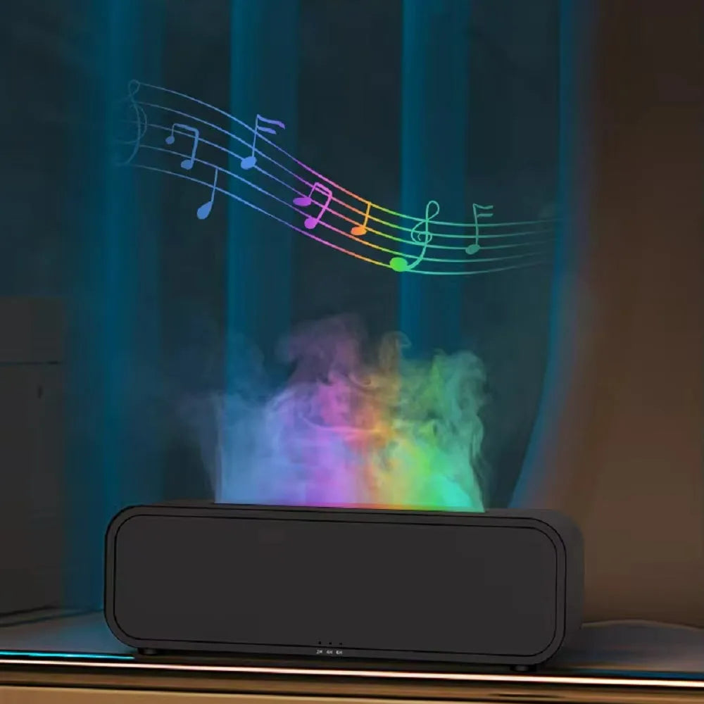 Black and white USB essential oil aroma diffuser with colour-changing light and remote control on a desk