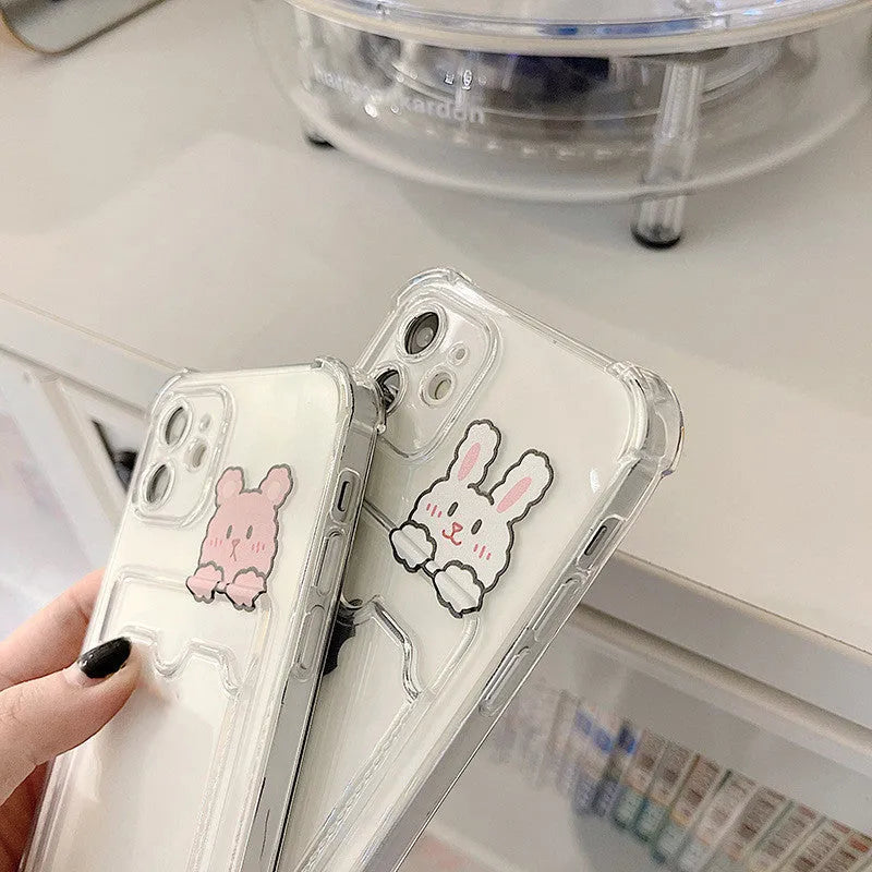 Transparent cartoon graphic iPhone back cover case with a slot for holding credit cards.