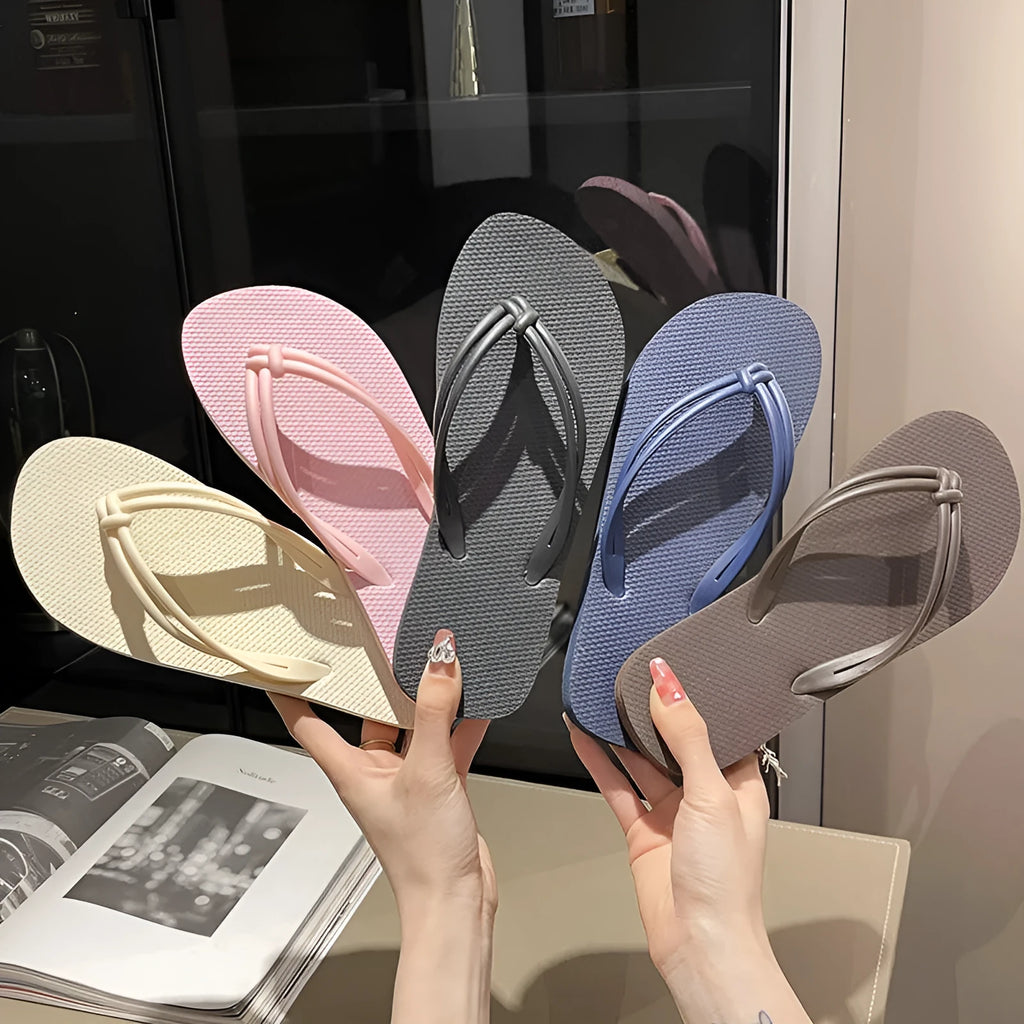 Men's PVC toe covering flip flops in beige on a plain background, showing non-slip sole.