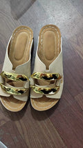 Roman style platform flip-flop sandals in white, black, khaki, and sea blue on a solid background
