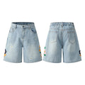Man wearing grey retro loose-fit washed cotton workwear shorts with a half elastic waistband.