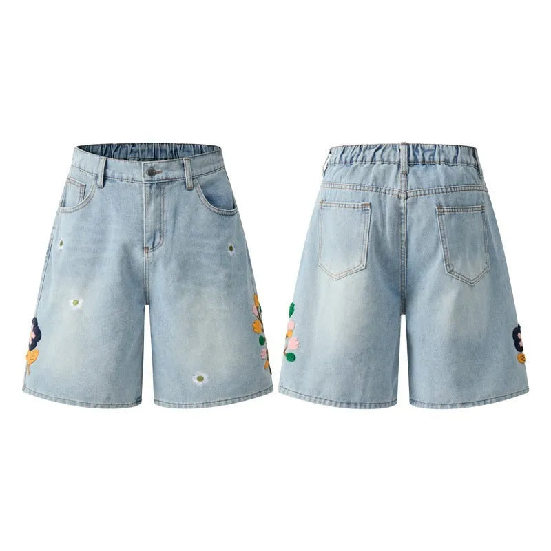 Man wearing grey retro loose-fit washed cotton workwear shorts with a half elastic waistband.