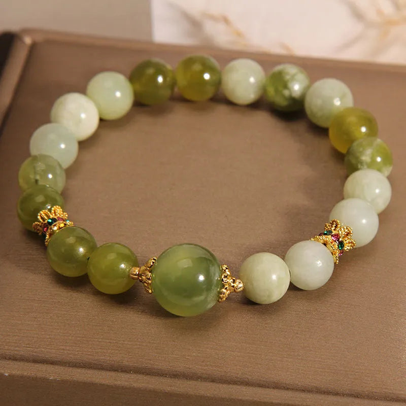 Xiuyan jade women's bracelet in jade green colour with natural stone patterns and Mori-style design