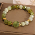 Xiuyan jade women's bracelet in jade green colour with natural stone patterns and Mori-style design