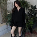 Women's geometric cable pattern knitted suit set with elastic waist shorts and long sleeve sweater
