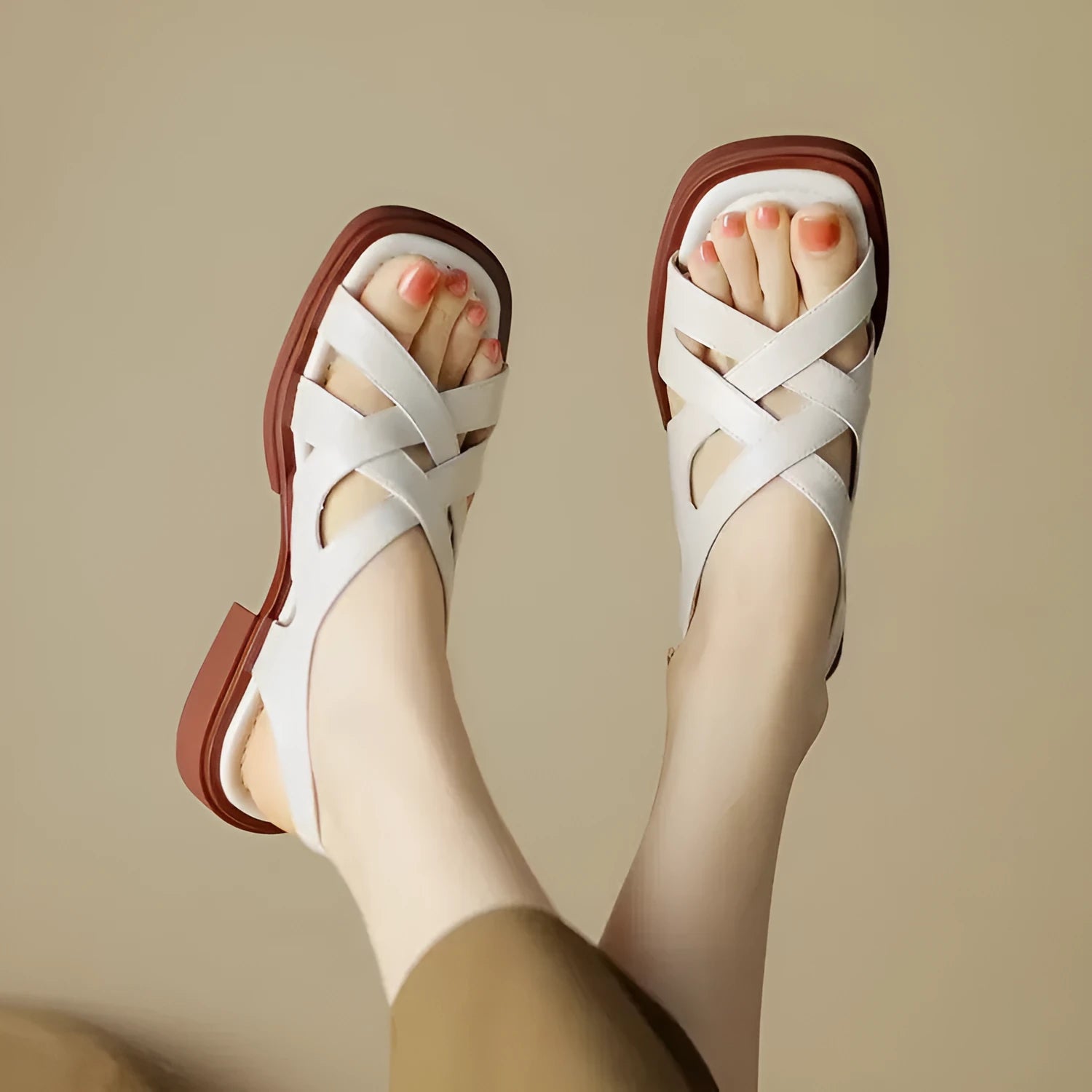 Women's glossy patent leather low heel sandals with square toe and cross-strap in black, brown and white.