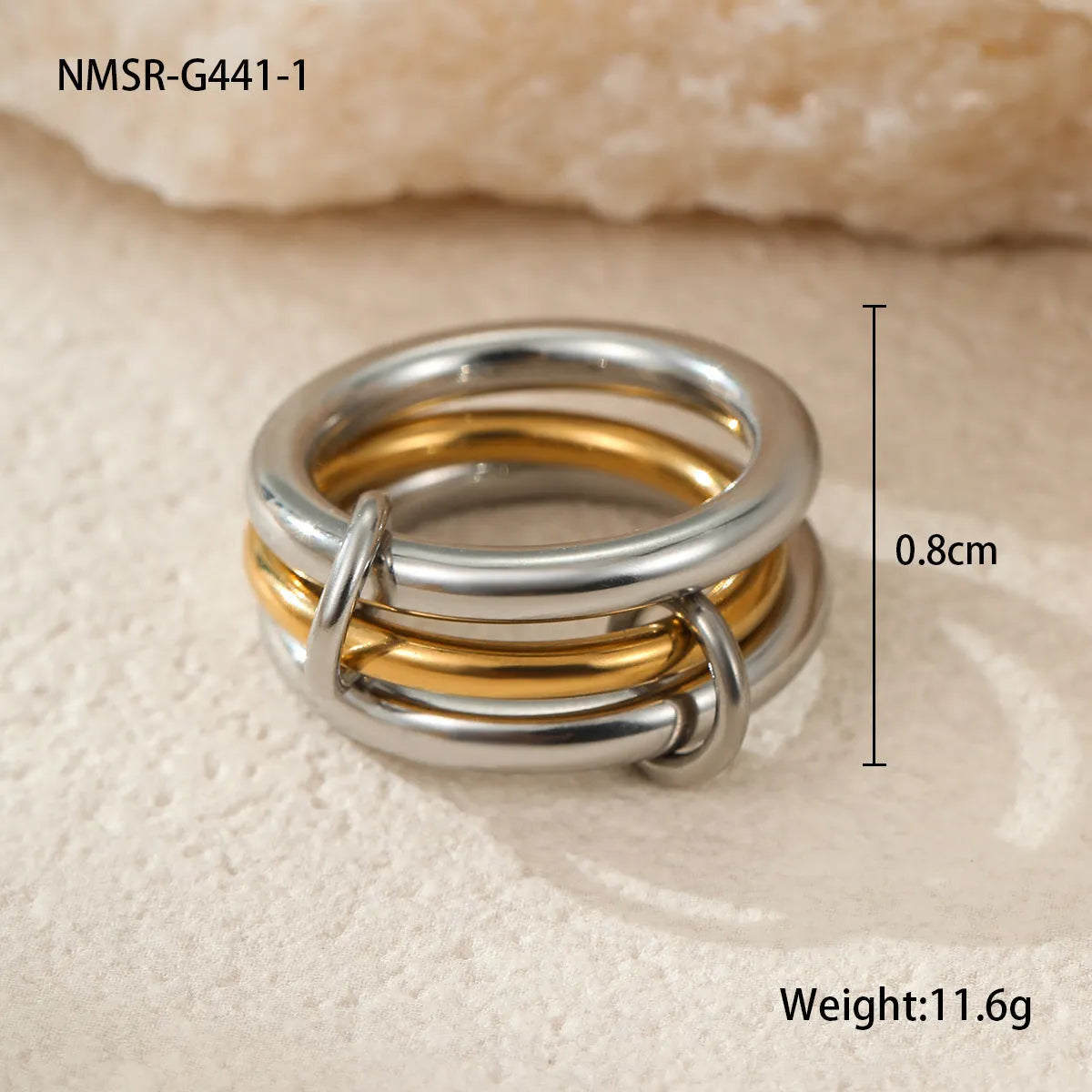 Stacked gold plated stainless steel ring set with exaggerated design on hand