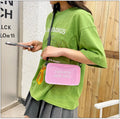 Transparent square jelly crossbody bag with adjustable strap in various colour options